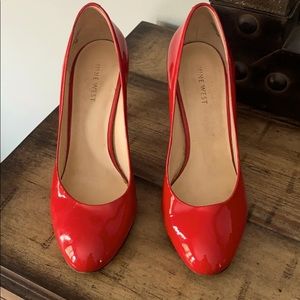 Nine West red patent pumps